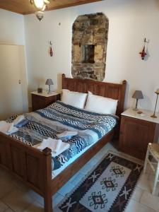 A bed or beds in a room at Magnolia Traditional Stone House in Vamvakou