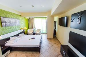 Телевизор и/или развлекательный центр в Hotel Prestige