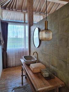 a bathroom with a sink on a wooden table at Stay at My Place Bali in Canggu