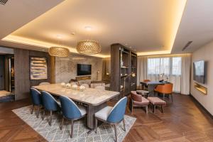a dining room with a table and chairs at InterContinental Barcelona by IHG in Barcelona