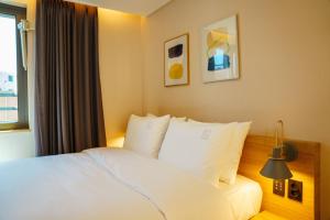 Postel nebo postele na pokoji v ubytování Hotel Pico