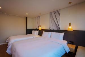 Postel nebo postele na pokoji v ubytování Hotel Pico