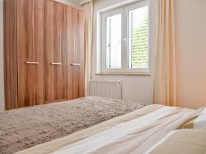 Postel nebo postele na pokoji v ubytování Apartments Villa Slavica
