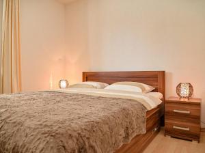 Postel nebo postele na pokoji v ubytování Apartments Villa Slavica
