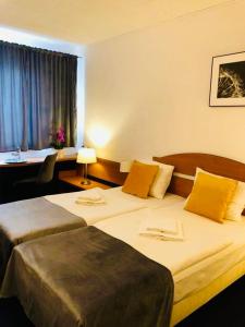 Postel nebo postele na pokoji v ubytování Aqua Hotel + 39 fotografií