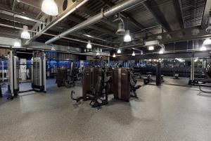 a gym with a bunch of equipment in a room at Village Hotel Edinburgh in Edinburgh
