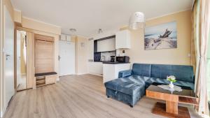Posedenie v ubytovaní Prywatne Apartamenty Sun & Snow w Wave z basenem