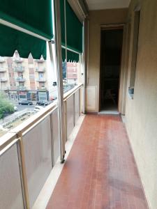 a hallway in a building with large windows at Alloggio Margherita in Turin