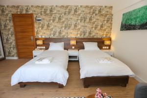 Postel nebo postele na pokoji v ubytování Avwan Hotel Çiğli