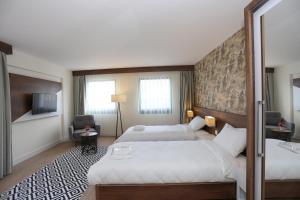 Postel nebo postele na pokoji v ubytování Avwan Hotel Çiğli + 33 fotografií