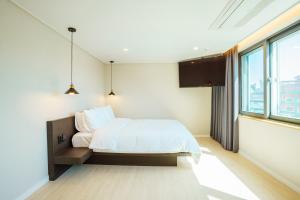 Postel nebo postele na pokoji v ubytování Hotel Pico