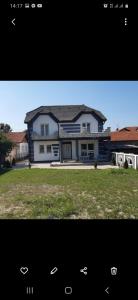 a picture of a large house with at Vila city in Bijeljina