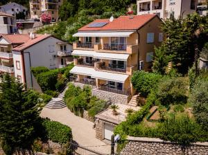 an aerial view of a large house on a hill at Apartments Villa Slavica in Ičići