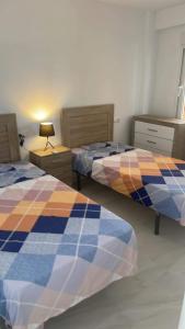 Ένα ή περισσότερα κρεβάτια σε δωμάτιο στο Torrevieja Los Locos-Luz De Mar