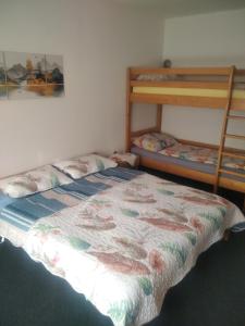 a bedroom with a bed and a bunk bed at Vinara Kupres in Kupres