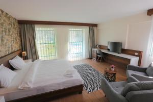Postel nebo postele na pokoji v ubytování Avwan Hotel Çiğli