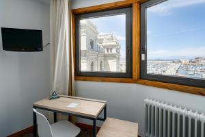 TV a/nebo společenská místnost v ubytování Hotel Alda Pasaje