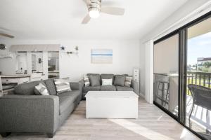 a living room with a couch and a table at Ocean Village Club J24 in Saint Augustine