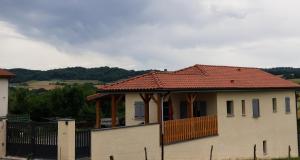 a house with a tiled roof on top of it at Maison 2 chambres avec vue sur les Pyrénées in Galan