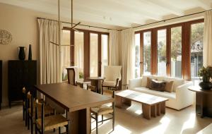 a living room with a table and a couch at The Storyteller Boutique House in Kalabaka