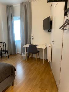 TV a/nebo společenská místnost v ubytování Sidsjö Hotell & Konferens