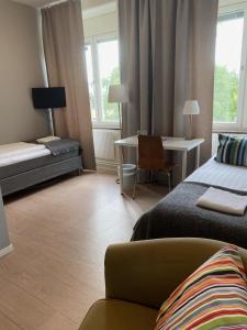 Postel nebo postele na pokoji v ubytování Sidsjö Hotell & Konferens