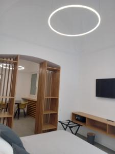 TV a/nebo společenská místnost v ubytování De Guidani Experience
