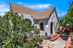 a small white house with a brown roof at Cedar Oasis in Ventura