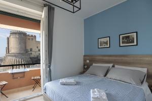 A bed or beds in a room at AnGiò holiday rooms