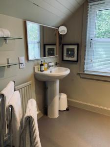 a bathroom with a sink and a mirror at the house@glenbarr in Glenbarr