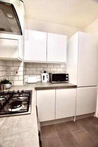 Кухня или мини-кухня в Trustay Serviced Apartments - Shoreditch
