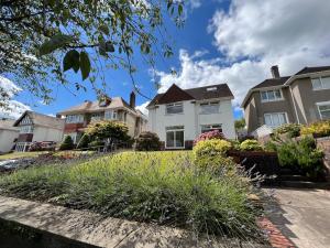 a row of houses in a residential neighborhood at Gower Getaway - Parking & Ensuite in Swansea