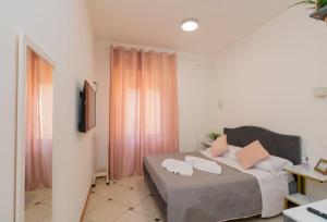 Posteľ alebo postele v izbe v ubytovaní Vitti's Home Verona 3