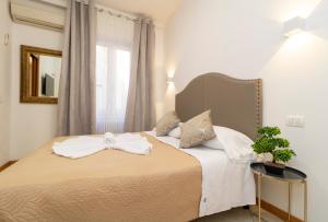Posteľ alebo postele v izbe v ubytovaní Vitti's Home Verona 3