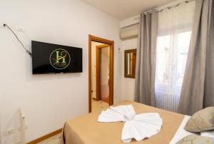 Posteľ alebo postele v izbe v ubytovaní Vitti's Home Verona 3