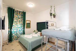 Posteľ alebo postele v izbe v ubytovaní Vitti's Home Verona 3