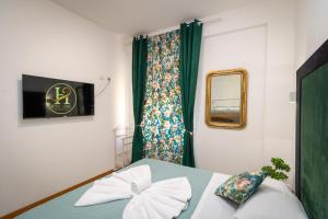 Posteľ alebo postele v izbe v ubytovaní Vitti's Home Verona 3