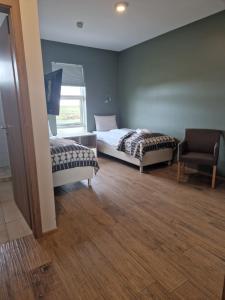 Postel nebo postele na pokoji v ubytování West Ranga lodge