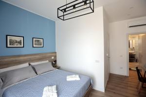 A bed or beds in a room at AnGiò holiday rooms