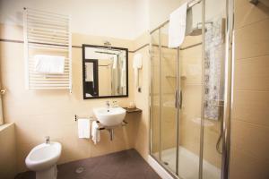 a bathroom with a toilet sink and a shower at Aventino Guest House in Rome +23 photos