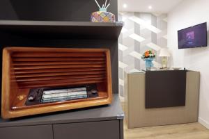 A television and/or entertainment centre at AnGiò holiday rooms