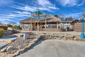 a restaurant with aiki drink sign on a building at Margaritaville Resort Golf Course Oasis with Hot Tub in Osage Beach