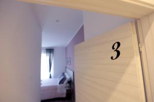 A bed or beds in a room at AnGiò holiday rooms