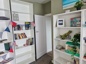 a room with white bookshelves and a door at 5 Berth bungalow in Mablethrorpe (Joe's Place) in Mablethorpe