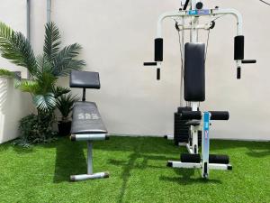 two exercise bikes in a room with grass at CASA SOLE - Apartamento Playa San Juan NR. 4 in Guía de Isora