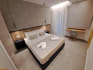 Postel nebo postele na pokoji v ubytování Pleasant Stay