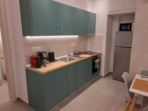 Kuchyň nebo kuchyňský kout v ubytování Pleasant Stay