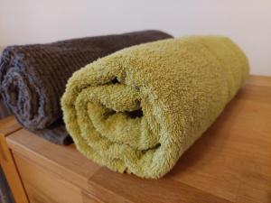 a brown towel sitting on top of a wooden table at Das Eckhaus in Murau