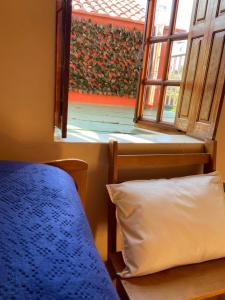 Łóżko lub łóżka w pokoju w obiekcie Casa las Hiedras