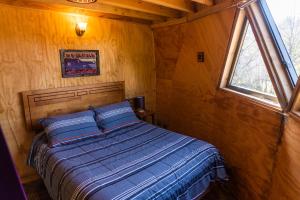 Postel nebo postele na pokoji v ubytování Centro Turístico Calafates del Llaima